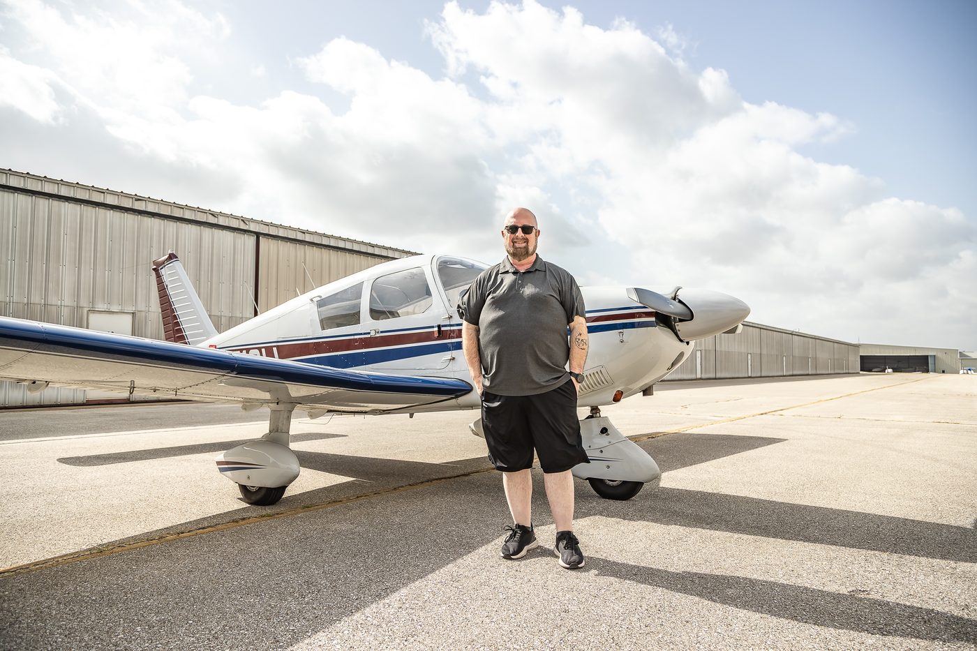 Lenny Tropiano standing with N8513W on the ramp